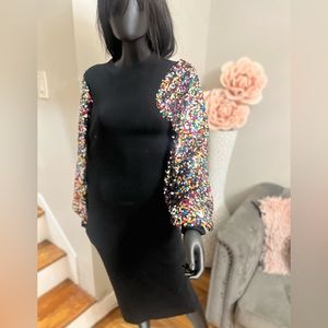 Midi black dress with sparkle puffy sleeve.